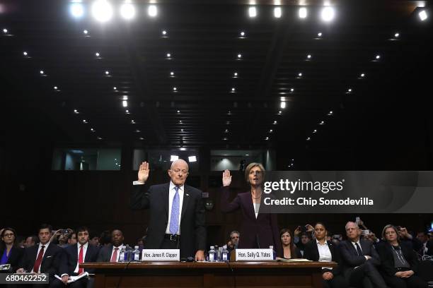 Former Director of National Intelligence James Clapper and former acting U.S. Attorney General Sally Yates are sworn in before testifying to the...