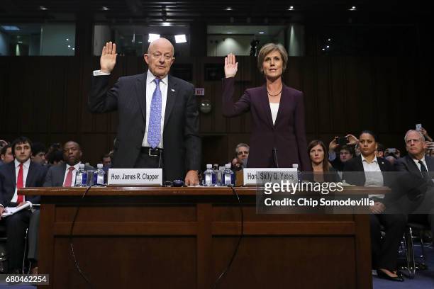 Former Director of National Intelligence James Clapper and former acting U.S. Attorney General Sally Yates are sworn in before testifying to the...