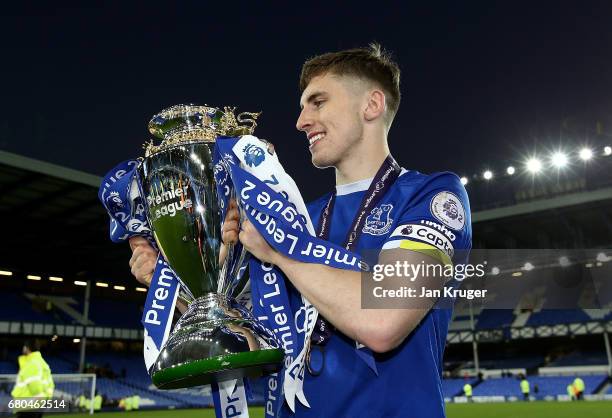 Jonjoe Kenny of Everton celebrates with the trophy during the Premier League 2 match between Everton and Liverpool at Goodison Park on May 8, 2017 in...