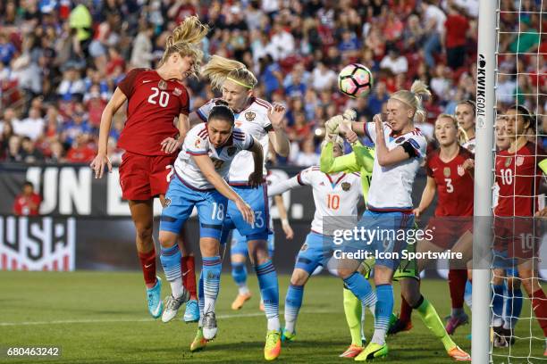 Midfielder Allie Long heads the ball past Russia defenders Elvira Ziiastinova , Anna Belomyttseva and midfielder Anna Cholovyaga for a goal during...