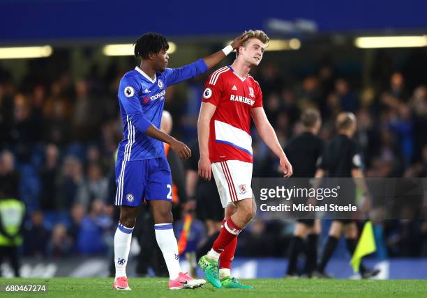 Nathaniel Chalobah of Chelsea consols Patrick Bamford of Middlesbrough after the game during the Premier League match between Chelsea and...