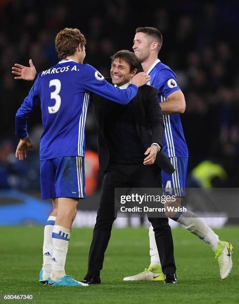 Antonio Conte, Manager of Chelsea and Marcos Alonso of Chelsea celebrate following the Premier League match between Chelsea and Middlesbrough at...