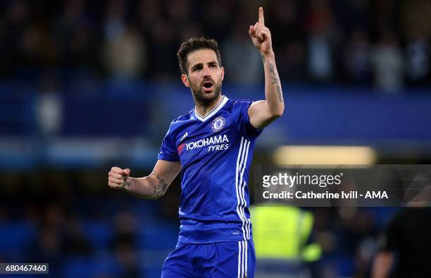 Cesc Fabregas of Chelsea indicates to the fans they need to win one more game after the Premier League match between Chelsea and Middlesbrough at...
