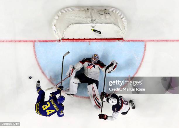 Jimmy Howard, goaltender of USA makes a save against Sweden during the 2017 IIHF Ice Hockey World Championship game between USA and Sweden at Lanxess...