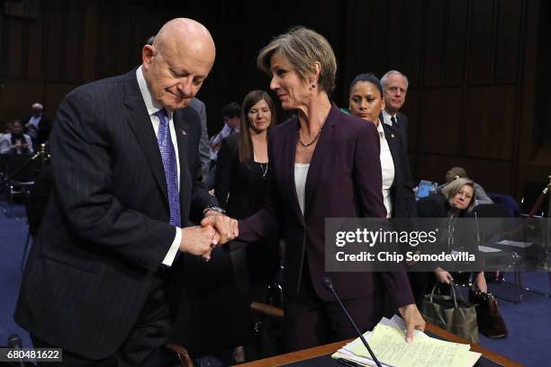 Former Director of National Intelligence James Clapper and former acting U.S. Attorney General Sally Yates shake hands after testifying before the...