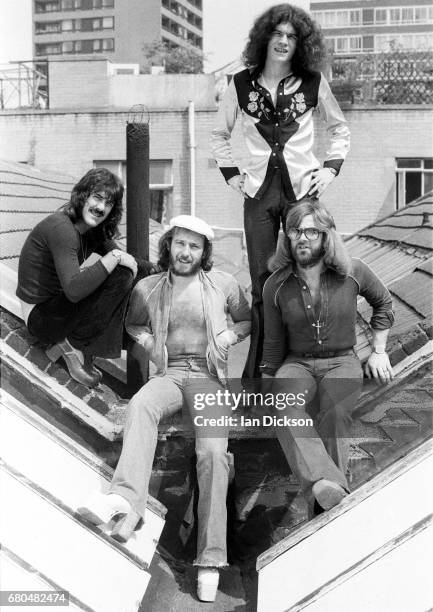 Nazareth, group portrait, on a rooftop in Kingly Court, London in 1975. L-R Manny Charlton, Pete Agnew, Dan McCafferty, Darrell Sweet.