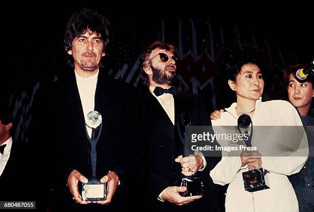 George Harrison, Ringo Starr, Yoko Ono and Sean Lennon at the 1988 Rock n Roll Hall of Fame Induction Ceremony circa 1988 in New York City.