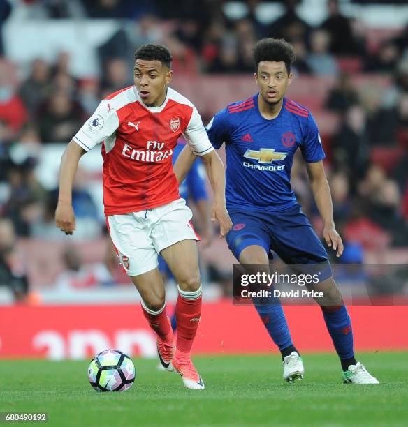 Donyell Malen of Arsenal takes on Cameron Borthwick-Jackson of Man Utd during the Premier League 2 match between Arsenal U23 and Manchester United...
