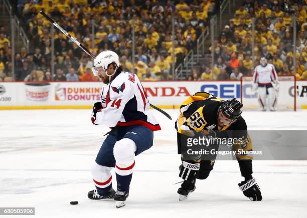Justin Williams of the Washington Capitals skates against Ron Hainsey of the Pittsburgh Penguins in Game Six of the Eastern Conference Second Round...