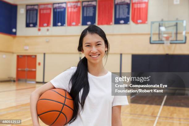 portrait of teenage basketball player in gym - cef do not delete stock pictures, royalty-free photos & images