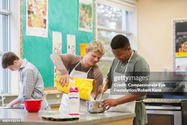 teenage students in cookery class - children cooking school stock-fotos und bilder