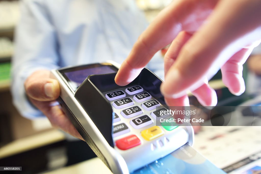 Card machine being used in shop