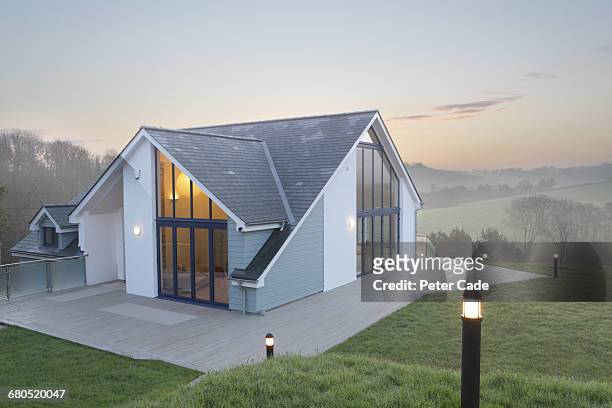 self build country home, morning mist - modern house dusk stock-fotos und bilder