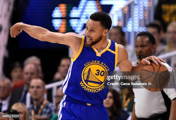 Stephen Curry of the Golden State Warriors directs a play in the first half against the Utah Jazz in Game Four of the Western Conference Semifinals...
