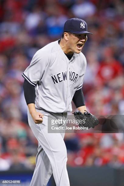 Masahiro Tanaka of the New York Yankees reacts after getting a double play with the bases loaded to end the first inning of a game against the...