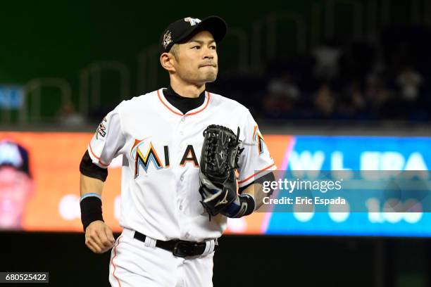 Ichiro Suzuki of the Miami Marlins runs into the dugout during the ninth inning against the St. Louis Cardinals at Marlins Park on May 8, 2017 in...