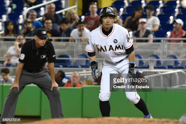 Ichiro Suzuki of the Miami Marlins takes a lead off first base during the eighth inning against the St. Louis Cardinals at Marlins Park on May 8,...