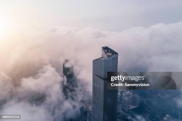 aerial view of modern skyline of guangzhou - skyscraper cloud stock pictures, royalty-free photos & images