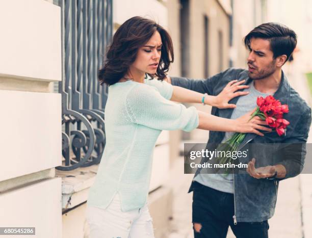 young couple arguing outside - relationship breakup stock pictures, royalty-free photos & images