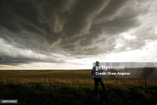 Tim Marshall, a 40 year veteran of storm chasing, monitors a supercell thunderstorm during a tornado research mission, May 8, 2017 in Elbert County...