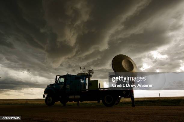 The Doppler on Wheels vehicle scans a supercell thunderstorm during a tornado research mission, May 8, 2017 in Elbert County near Agate, Colorado....