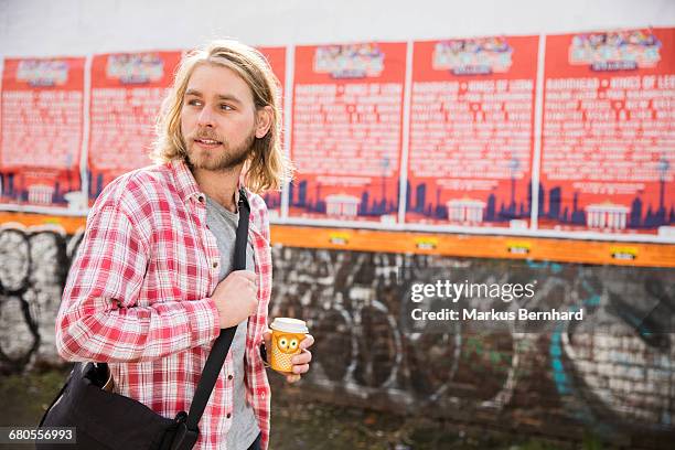 confident man walking - berlin graffiti stock-fotos und bilder