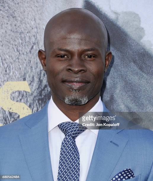 Actor Djimon Hounsou arrives at the Los Angeles Premiere "King Arthur: Legend Of The Sword" at TCL Chinese Theatre on May 8, 2017 in Hollywood,...