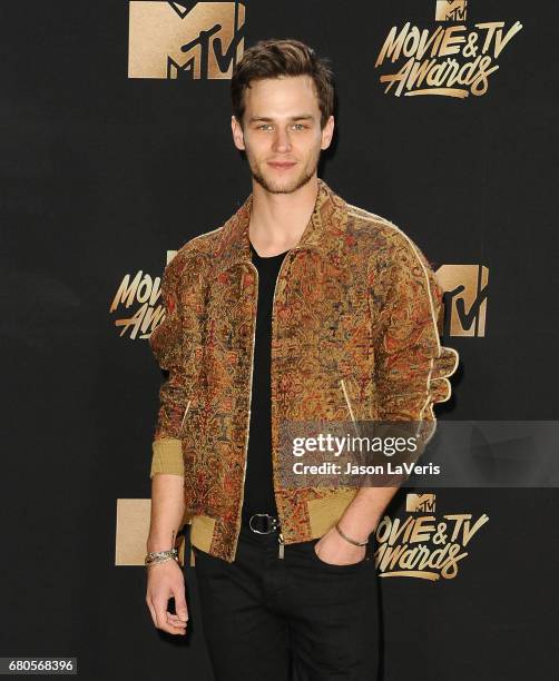 Actor Brandon Flynn poses in the press room at the 2017 MTV Movie and TV Awards at The Shrine Auditorium on May 7, 2017 in Los Angeles, California.