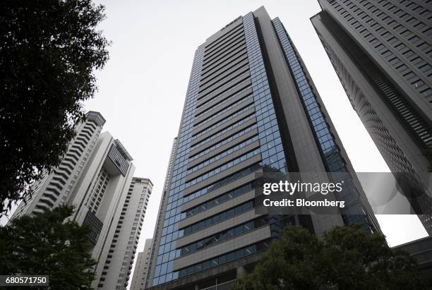 The Mitsubishi Heavy Industries Ltd. Headquarters, center, stands in Tokyo, Japan, on Tuesday, May 9, 2017. The company plans to reduce workers on...