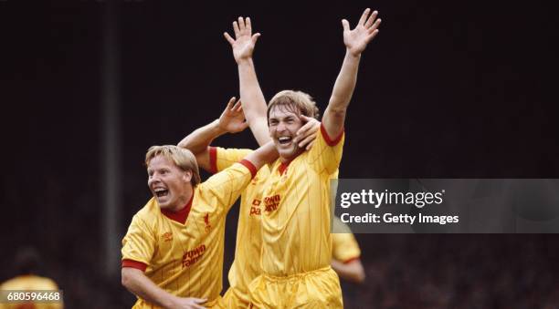 Liverpool player Sammy Lee congratulates Kenny Dalglish after Dalglish had scored the opening goal in a First Divsion match against Arsenal at...