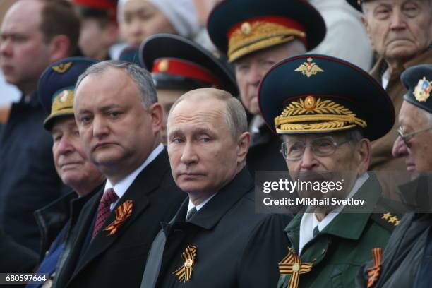 Russian President Vladimir Putin and President of Moldova attend the Victory Day military parade to celebrate the 72nd anniversary of the victory in...