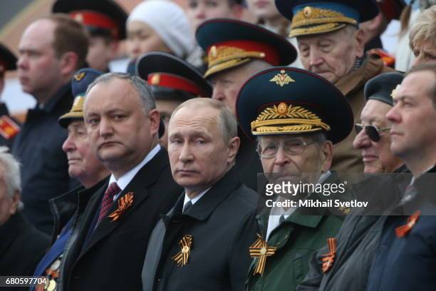 Russian President Vladimir Putin , Prime Minister Dmitry Medvedev and President of Moldova attend the Victory Day military parade to celebrate the...