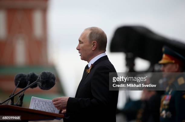 Russian President Vladimir Putin gives a speech as he attends the Victory Day military parade to celebrate the 72nd anniversary of the victory in...