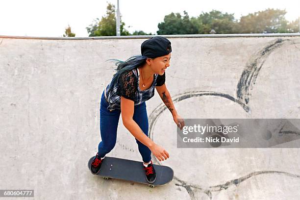 skateboarders - women skateboarding stock pictures, royalty-free photos & images