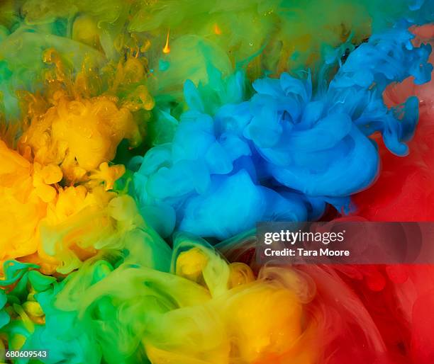 plumes of colourful paint underwater - coloursurgetrend stock-fotos und bilder