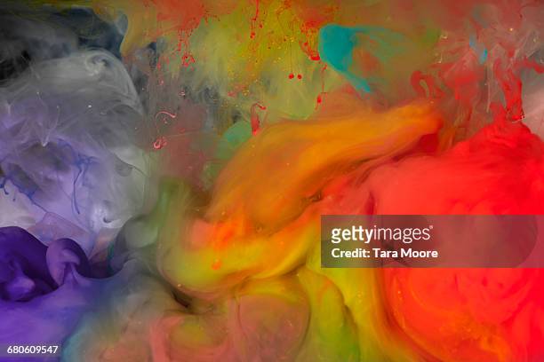 bright coloured paint underwater - colorsurgetrend imagens e fotografias de stock