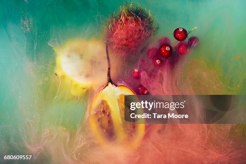 Exotic fruit and paint shot underwater Exotic fruit and paint shot underwater