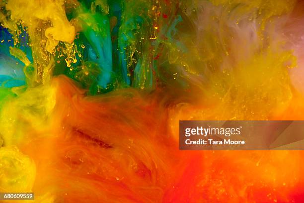 bright coloured paint underwater - color image stock pictures, royalty-free photos & images