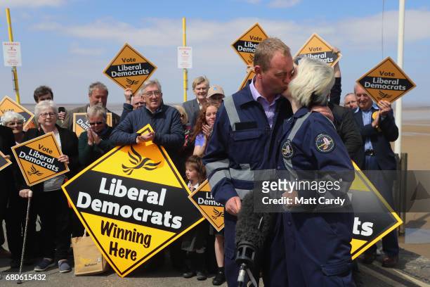 Leader of the Liberal Democrats Tim Farron greets a volunteer as he campaigns at a volunteer-run Rescue Boat Service on May 9, 2017 at...