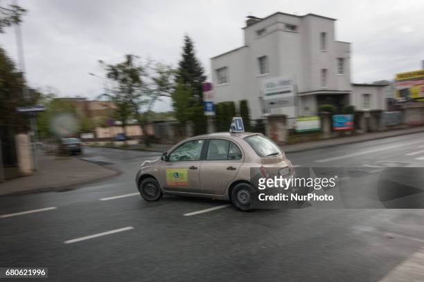 Nissan Micra car used for driving lessons is seen making a turn in Bydgoszcz, Poland on 8 May, 2017.