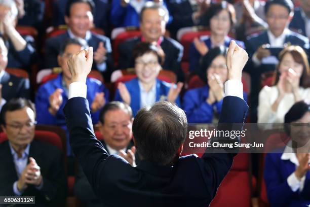 South Korean presidential candidate Moon Jae-in of the Democratic Party of Korea reacts after a television report on an exit poll of the new...