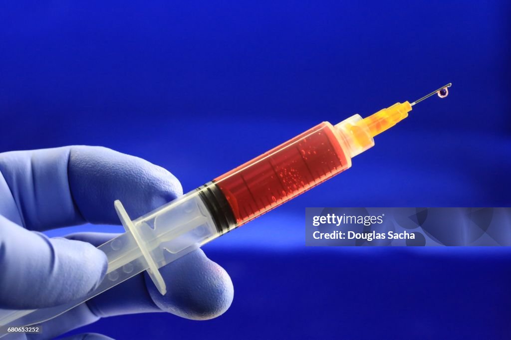 Image of syringe with hypodermic needle, close-up