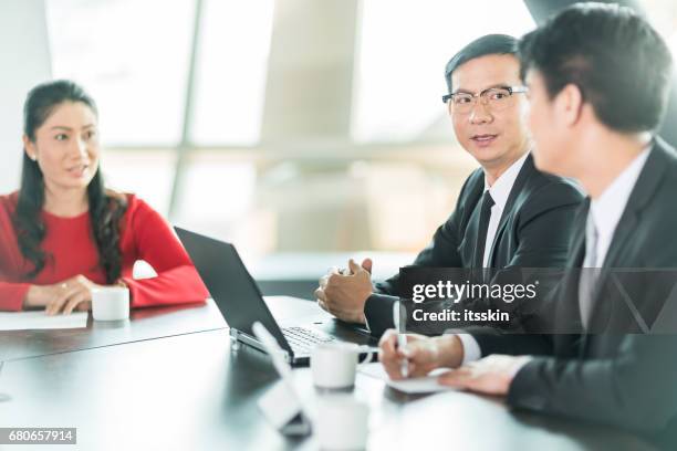 white collar worker discuss the details of the project - servant leadership stock pictures, royalty-free photos & images