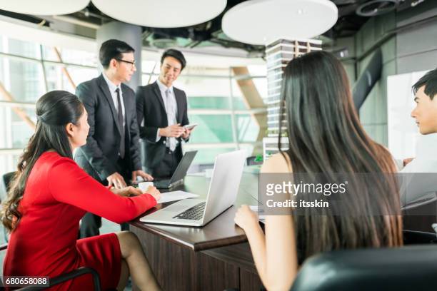 white collar worker discuss the details of the project - servant leadership stock pictures, royalty-free photos & images