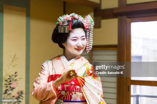 maiko girl posing in japanese tatami room - geisha in training stock pictures, royalty-free photos & images