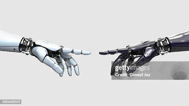 black and white robot hand pointing at each other - robotarm robot stockfoto's en -beelden