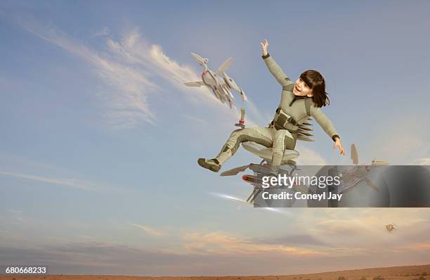young girl on futuristic flying chair - child robot stock pictures, royalty-free photos & images