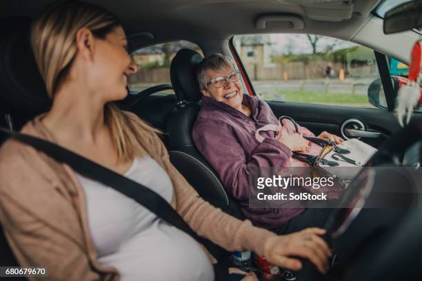 taking grandma shopping - pregnant woman car stock pictures, royalty-free photos & images