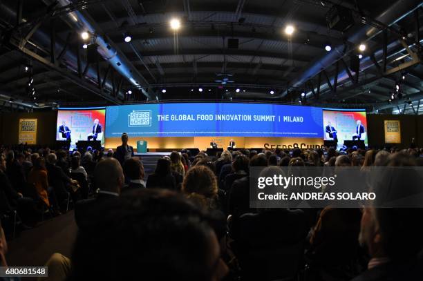 Former President Barack Obama speaks with Sam Kass, food entrepreneur and former White House chef, during the third edition of "Seed & Chips: The...