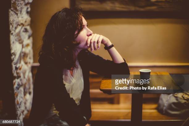 woman deep in thought at the bar - relationship difficulties stock pictures, royalty-free photos & images